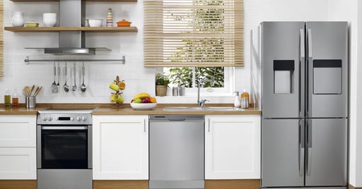 A modern kitchen with stainless steel appliances.
