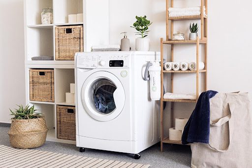 A washing machine in a laundry room.