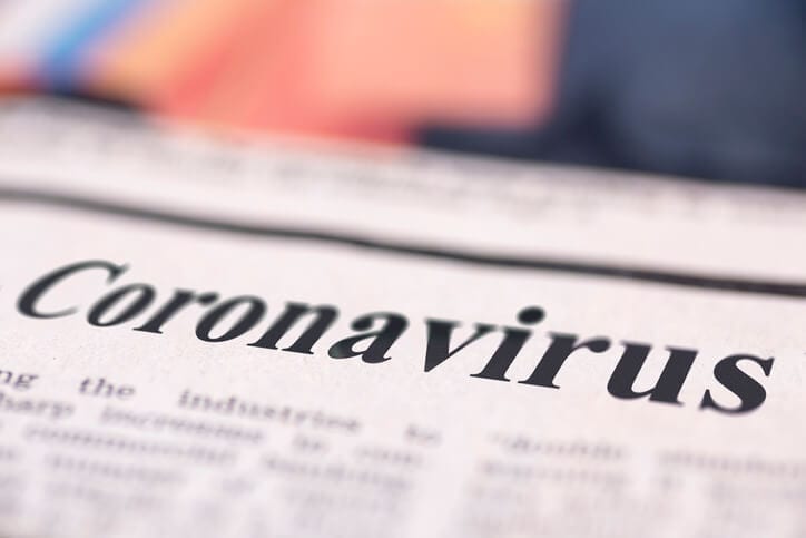 A newspaper with the headline Coronavirus