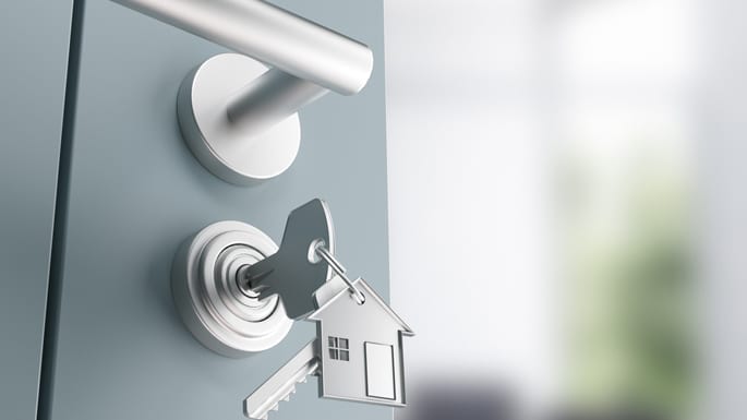 A key is inserted into a doorlock.